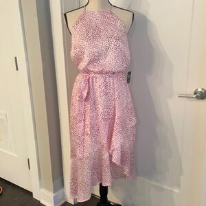 Dotted high neck, asymmetrical fit and flare dress​